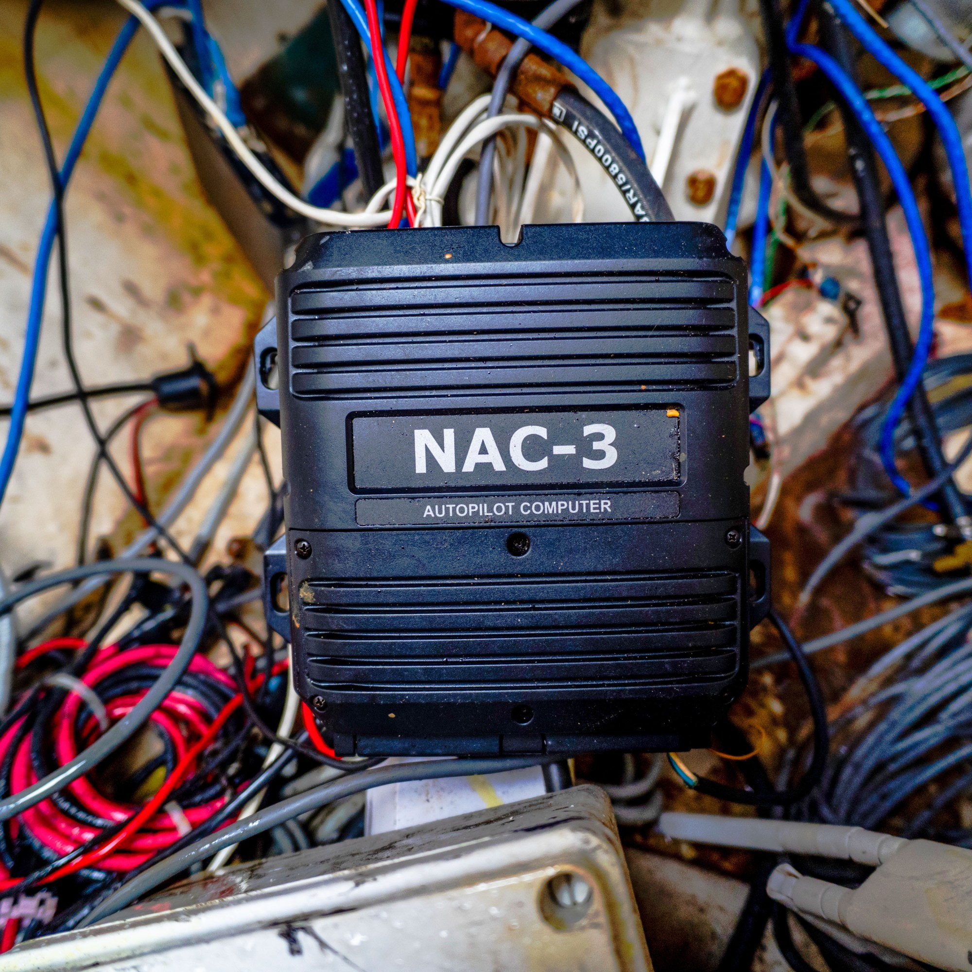 tangle of wires and a black box that says, "NAC-3"