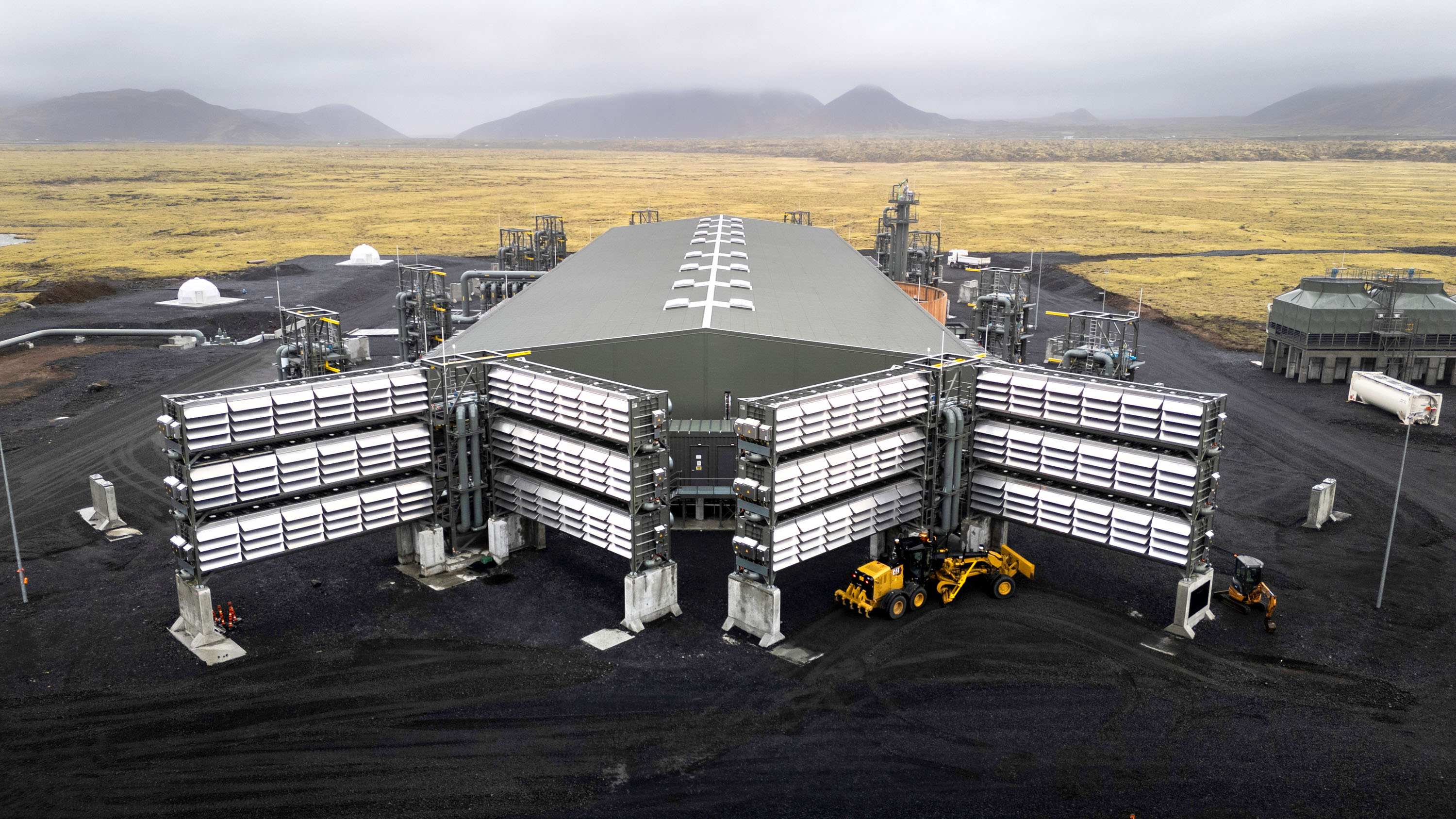 Aerial view of the Mammoth plant in Iceland with four large bays of carbon fans in front of a long warehouse building